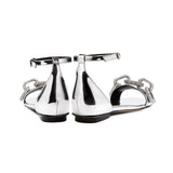 Catena Mirror Flat Ankle Sandal showcasing a sleek silver design with chain detail and an adjustable ankle strap.
