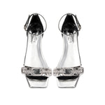 Catena Mirror Flat Ankle Sandal featuring clear straps and a chic design, perfect for stylish summer outings.