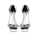 Catena Mirror Flat Ankle Sandal featuring clear straps and a chic design, perfect for stylish summer outings.