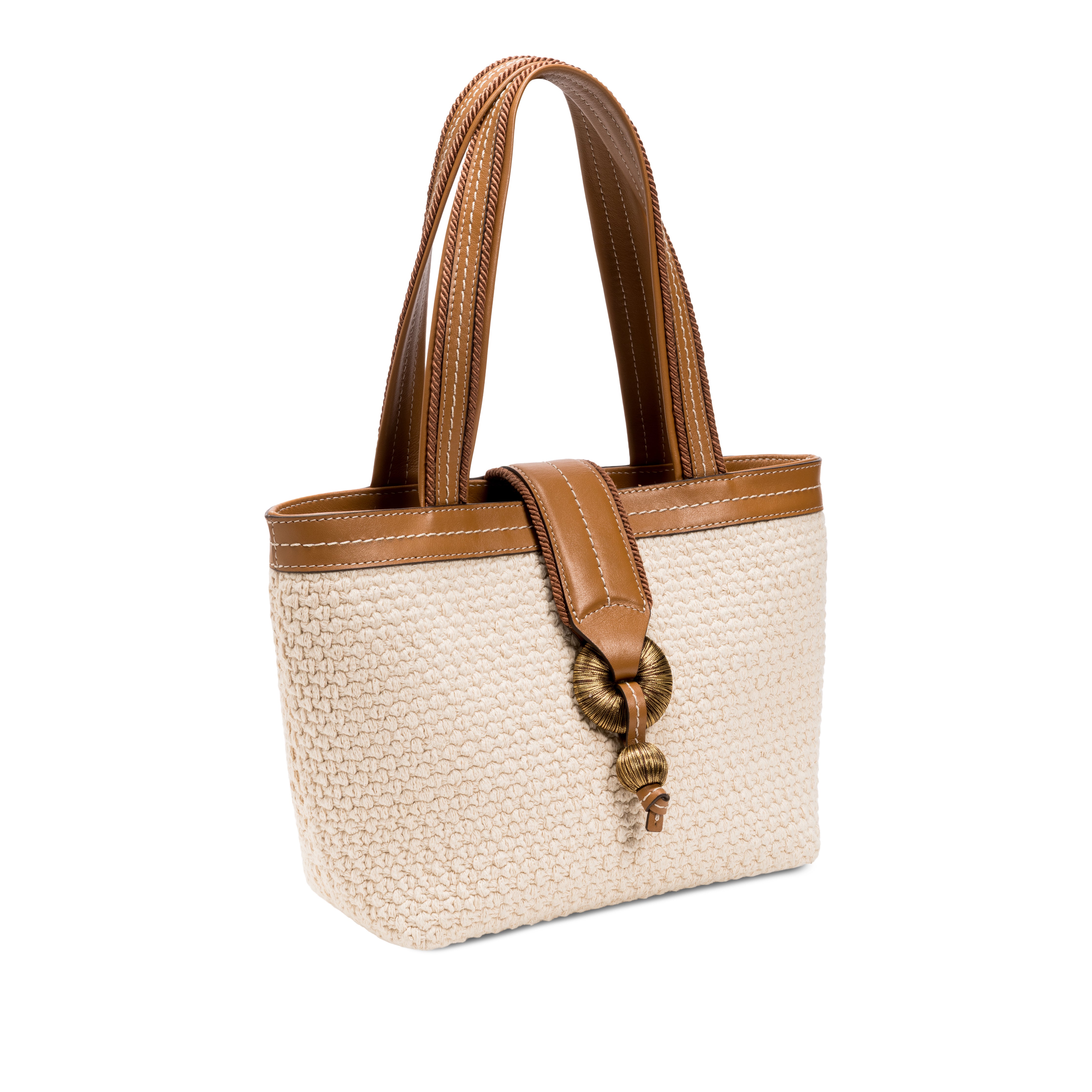 Boho chic small off white tote bag with leather handles and decorative buckle detail.