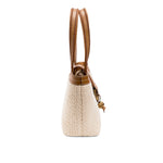 Side view of a Boho Chic small off white tote bag with brown handles and details.