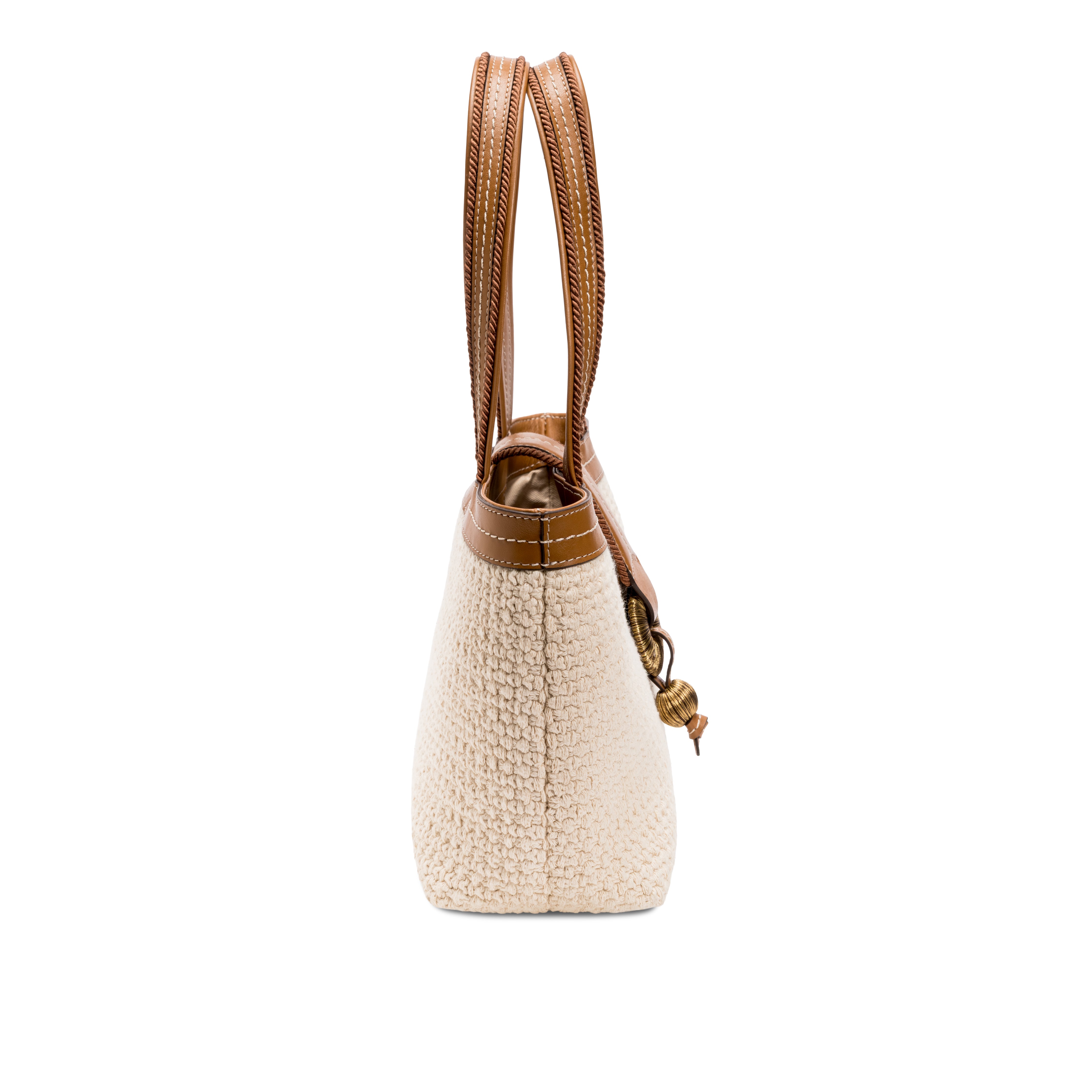 Side view of a Boho Chic small off white tote bag with brown handles and details.