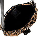 Leopard print handbag with a black interior on a white background