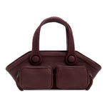 Burgundy handbag with two square compartments on a white background