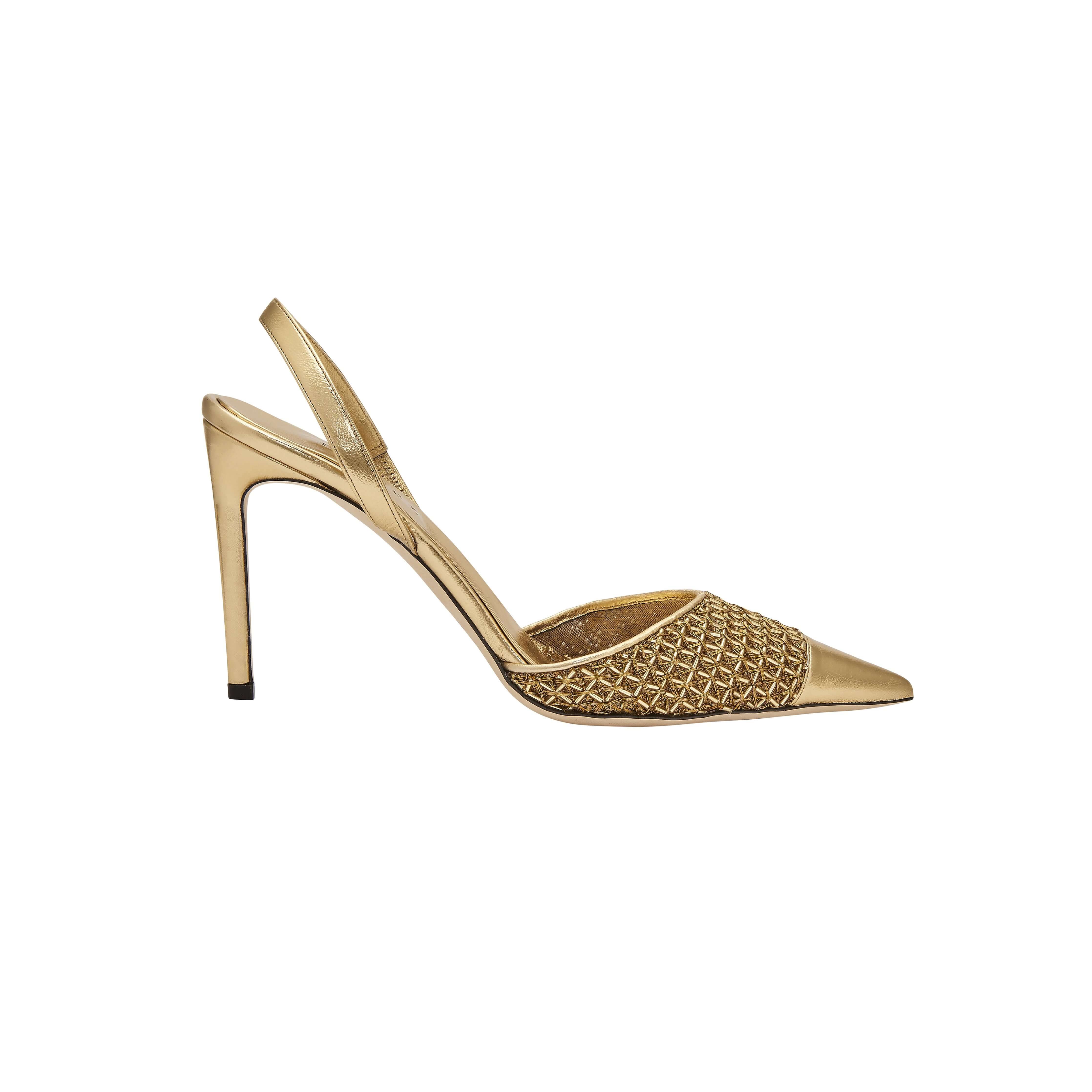 Adia gold high-heel slingback pump featuring metallic leather caging, perfect for versatile day or night wear.