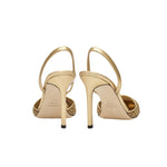 Adia Gold High-Heel Slingback Pump showcasing a stylish back view, featuring elegant metallic leather details.