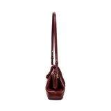 Side view of Alessa Burgundy Pouch Bag showcasing its stylish design and adjustable shoulder strap.