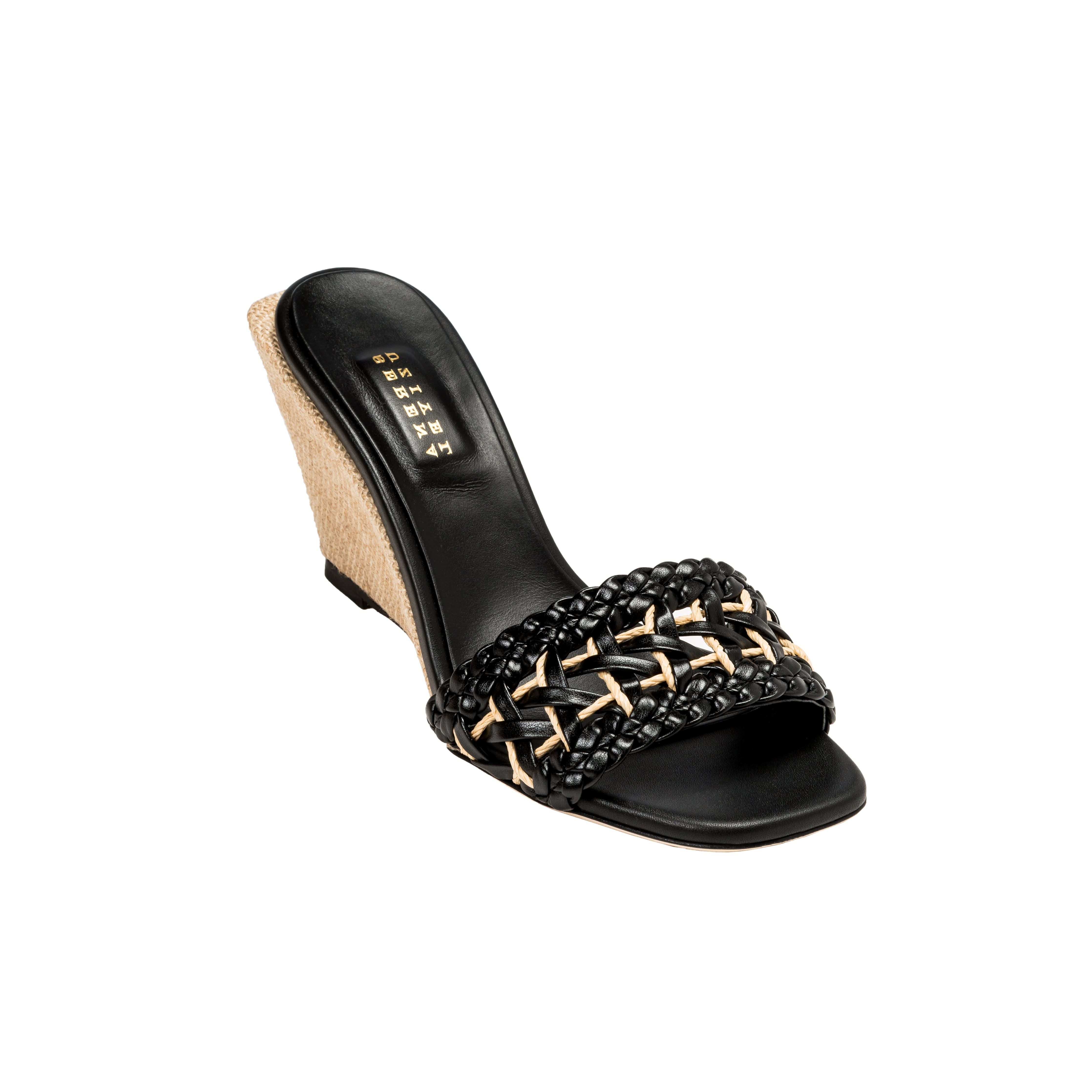 Almeria Black Wedge Sandal featuring a woven strap design and stylish wedge heel, perfect for summer occasions.