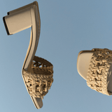 Almeria nude block-heel sandals showcasing a braided strap and open toe design, crafted from supple Italian leather.