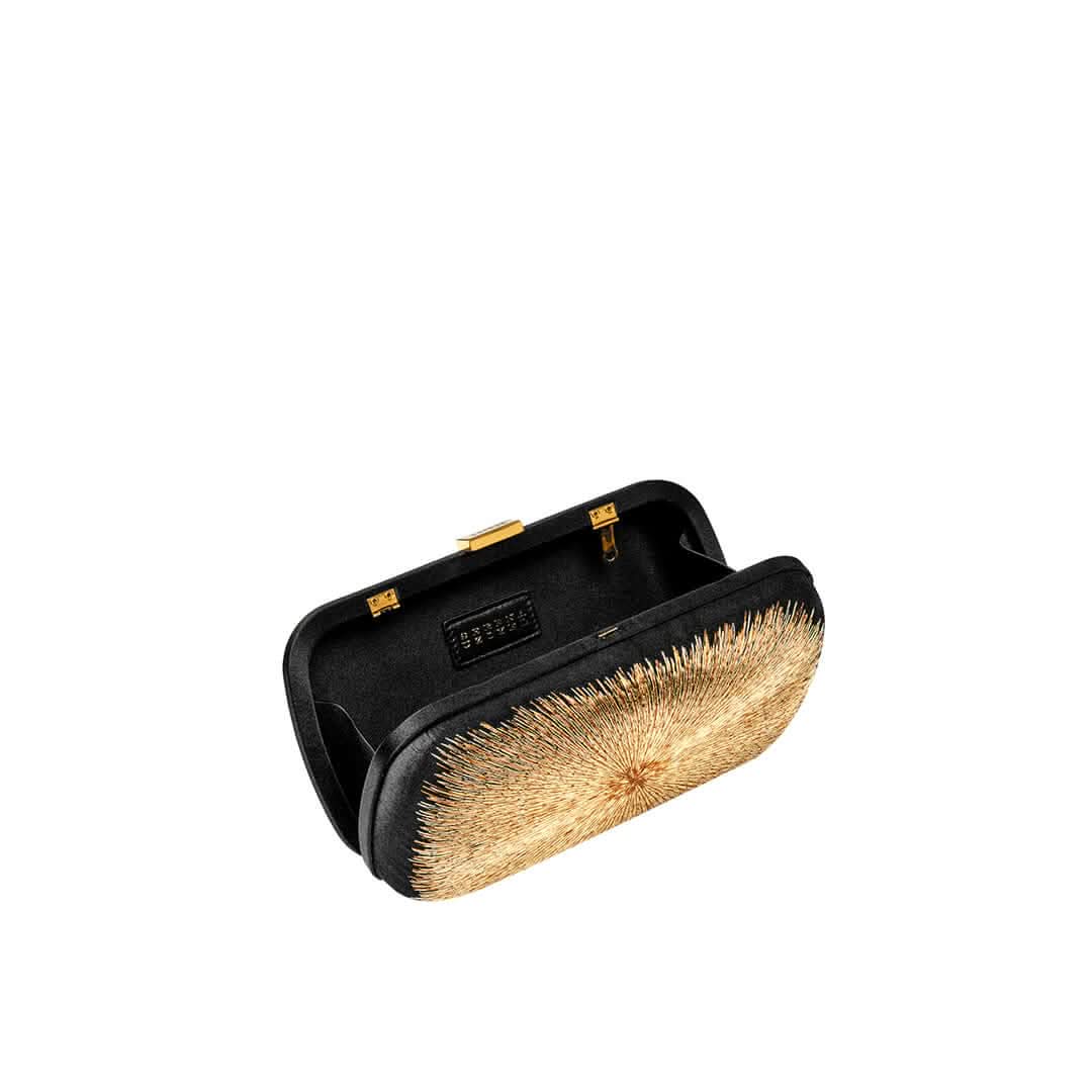 Arinna Black Clutch with intricate bronze and gold embroidery, inspired by Mesopotamian sun rays, elegantly showcasing its interior.