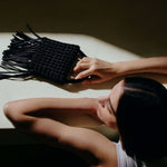 Aurnia Black Mini Tote Bag with leather and silk braiding, showcasing modern sophistication for day and night use.