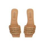Aurnia Latte Flat Sandal featuring stylish woven straps and a comfortable flat sole, perfect for casual summer outings.