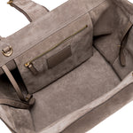 Interior view of the Boho Chic Medium Taupe Tote Bag showcasing the soft suede lining and zippered pocket.
