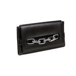 Elegant black clutch with antique silver chain detail for a sophisticated accessory look.