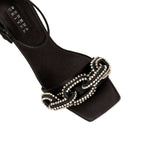 Close-up of Catena Black High-Heel Ankle Sandal featuring elegant crystal-wrapped chain design.