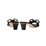 Back view of Catena Black Mid-Heel Sandal showcasing its elegant chain link design and sturdy block heel.