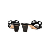 Back view of Catena Black Mid-Heel Sandal showcasing its elegant chain link design and sturdy block heel.