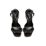 Stylish Catena Black Platform Ankle Sandals featuring open toe and ankle-strap, adorned with signature chain embellishments.