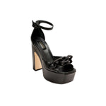 Catena Black Platform Ankle Sandal featuring 70’s inspired design, chunky heel, and signature chain embellishments.