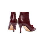 Catena Burgundy High-Heel Ankle Boot showcasing elegant design with suede embellishment, perfect for sophisticated outfits.