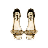 Elegant Catena gold flat ankle sandals featuring stylish straps and a sleek design, perfect for summer outings.