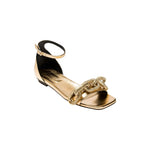 Elegant Catena Gold Flat Ankle Sandal featuring a decorative chain detail, perfect for stylish summer outfits.