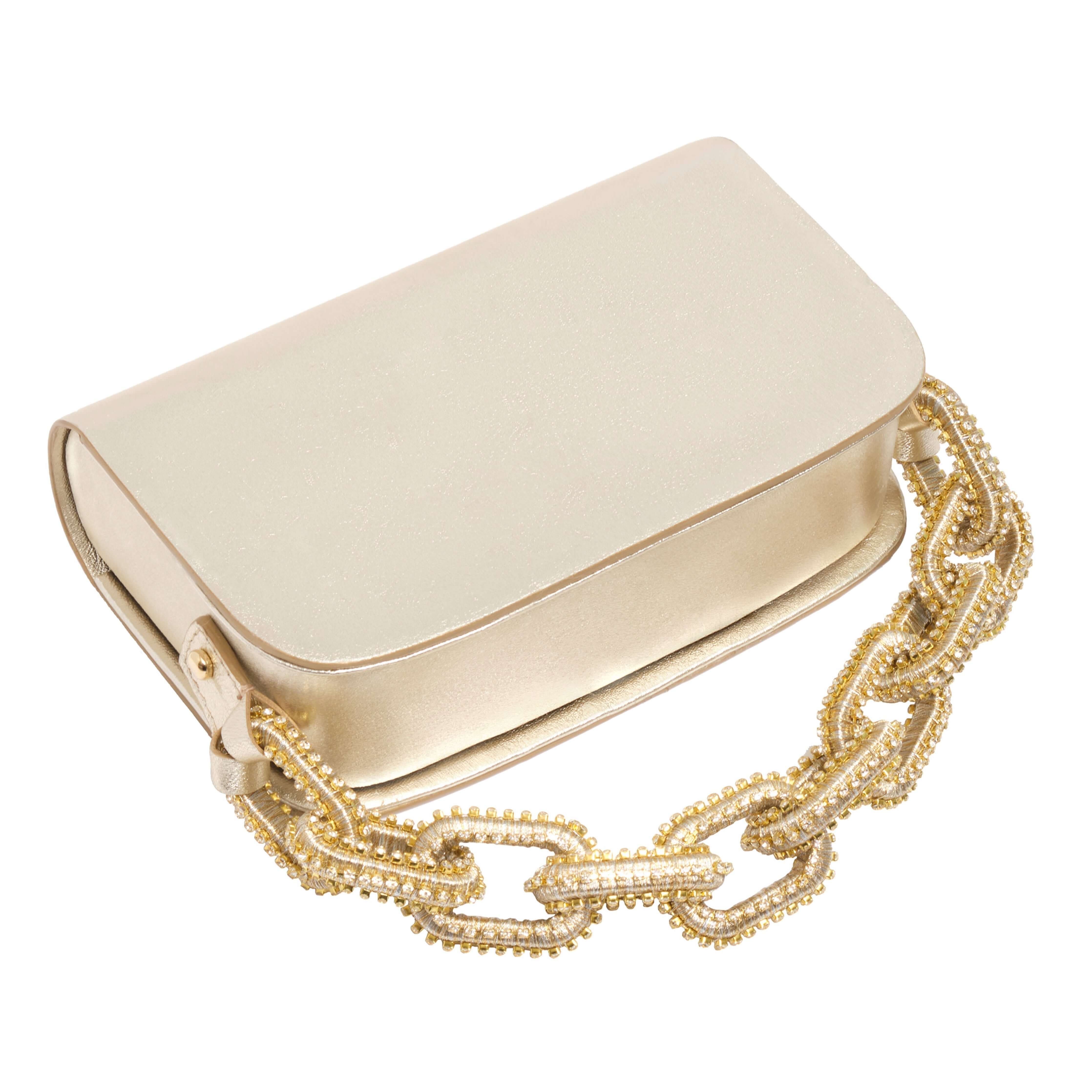 Catena Gold & Glam Two-Sided Bag in luxurious gold leather with a decorative chain-link handle.