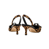 Catena Leopard Mid-Heel Slingback Pump showcasing elegant leopard print and black leather details.