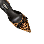 Catena Leopard Mid-Heel Slingback Pump featuring pointed toe and black leather strap with signature chain detail.
