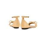 Back view of Catena Natural Flat Ankle Sandal showcasing the elegant design and natural raffia chain detail.