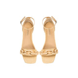 Catena Natural Flat Ankle Sandal featuring a natural raffia chain for elegance and comfort.