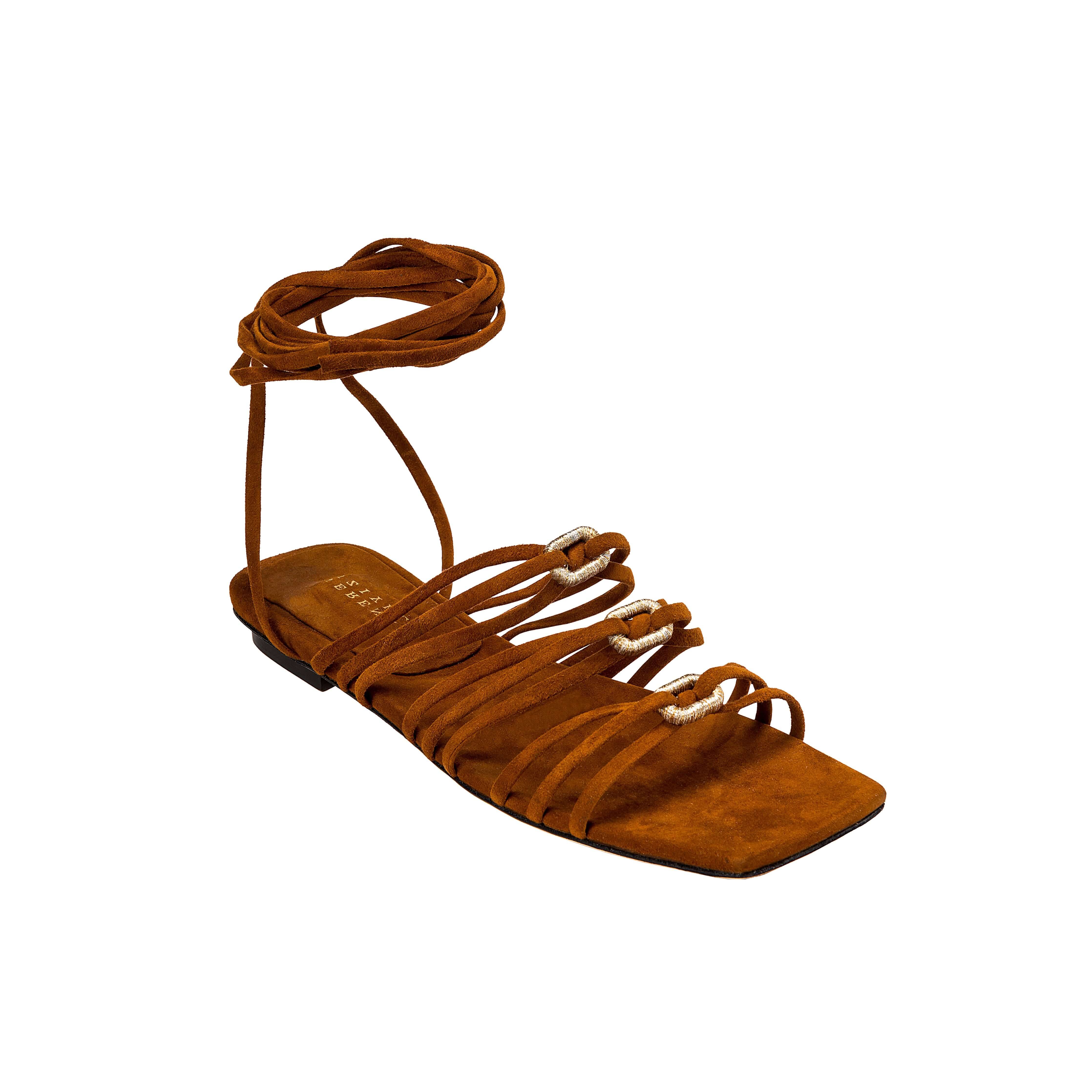Catena Notte Camello flat lace-up sandal with soft suede straps and golden accents, perfect for summer adventures.