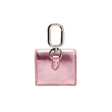 Sculptural metallic pink AirPods case with silver carabiner, handcrafted in Italy for stylish functionality.