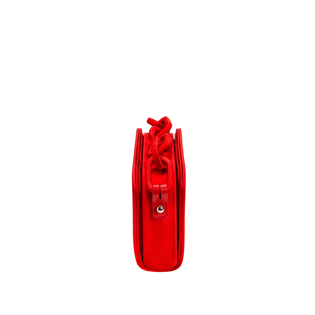 Catena Scarlet Two-Sided Bag in luxurious silk satin, showcasing intricate chain-link handle and sleek red design.