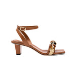 Delphine Camello mid-heel ankle cross sandal in brown with a stylish strap and unique decor for a chic look.