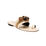 Delphine Nude Flat Toe Sandal featuring earth-toned beads and a comfortable wide strap, perfect for summer styles.