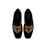 Fiocco black velvet flat moccasin with antique gold embroidered bow, highlighting comfort and chic autumn style.