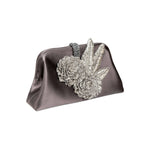 Fiora Electrum Pouch Bag featuring exquisite silver flower embellishments, perfect for elegant evening events.