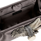 Interior view of the Fiora Electrum Pouch Bag showcasing elegant silver embellishments and luxurious fabric.