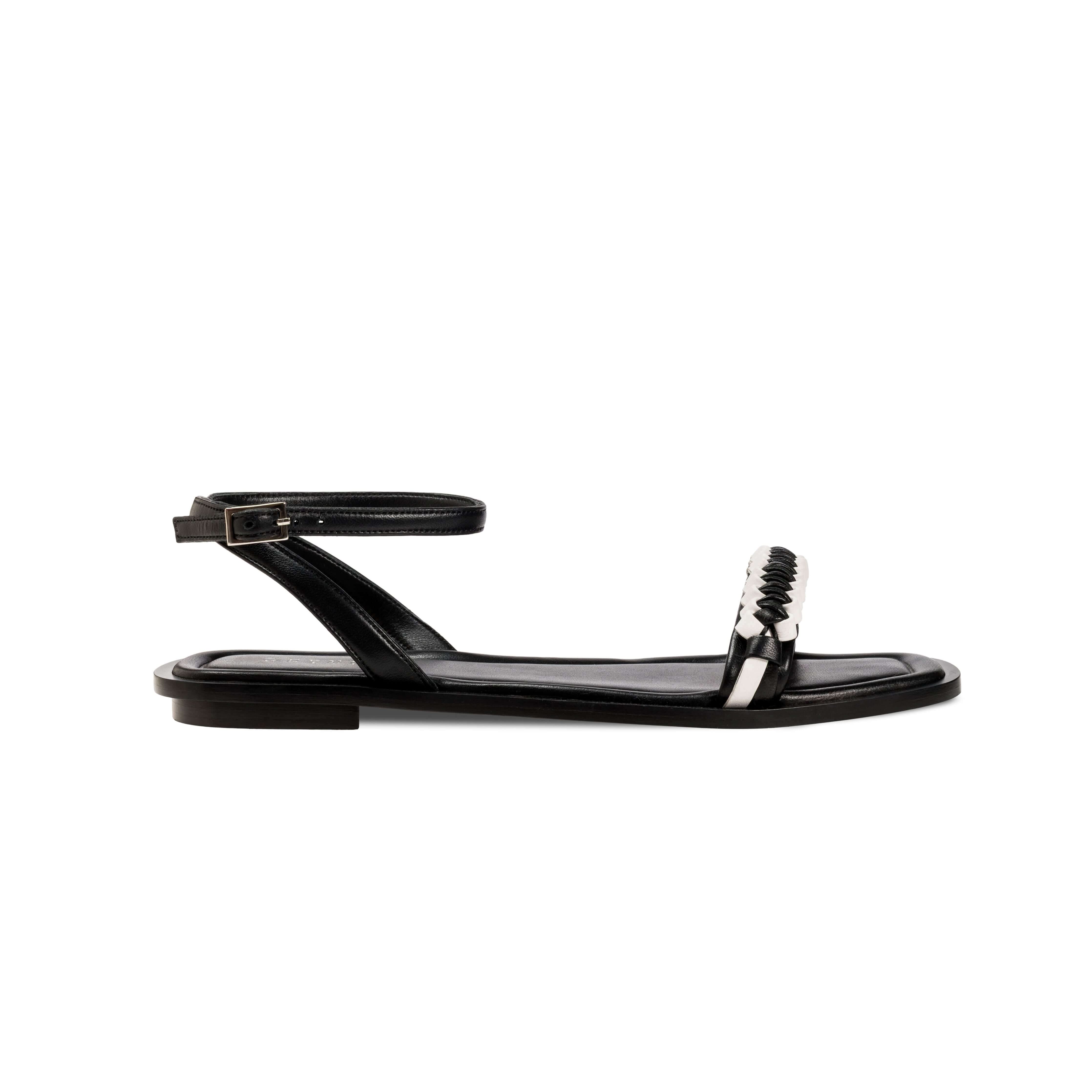 Kibele Black Ankle Cross Sandal featuring a sleek design and stylish ankle strap for a chic summer look.