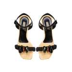 Melita Natural Wedge Ankle Sandal with raffia, stone accents, and black rope straps for stylish summer comfort.