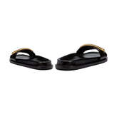 Naria Black Comfort Slide sandals with a stylish gold strap, offering casual elegance and comfort.