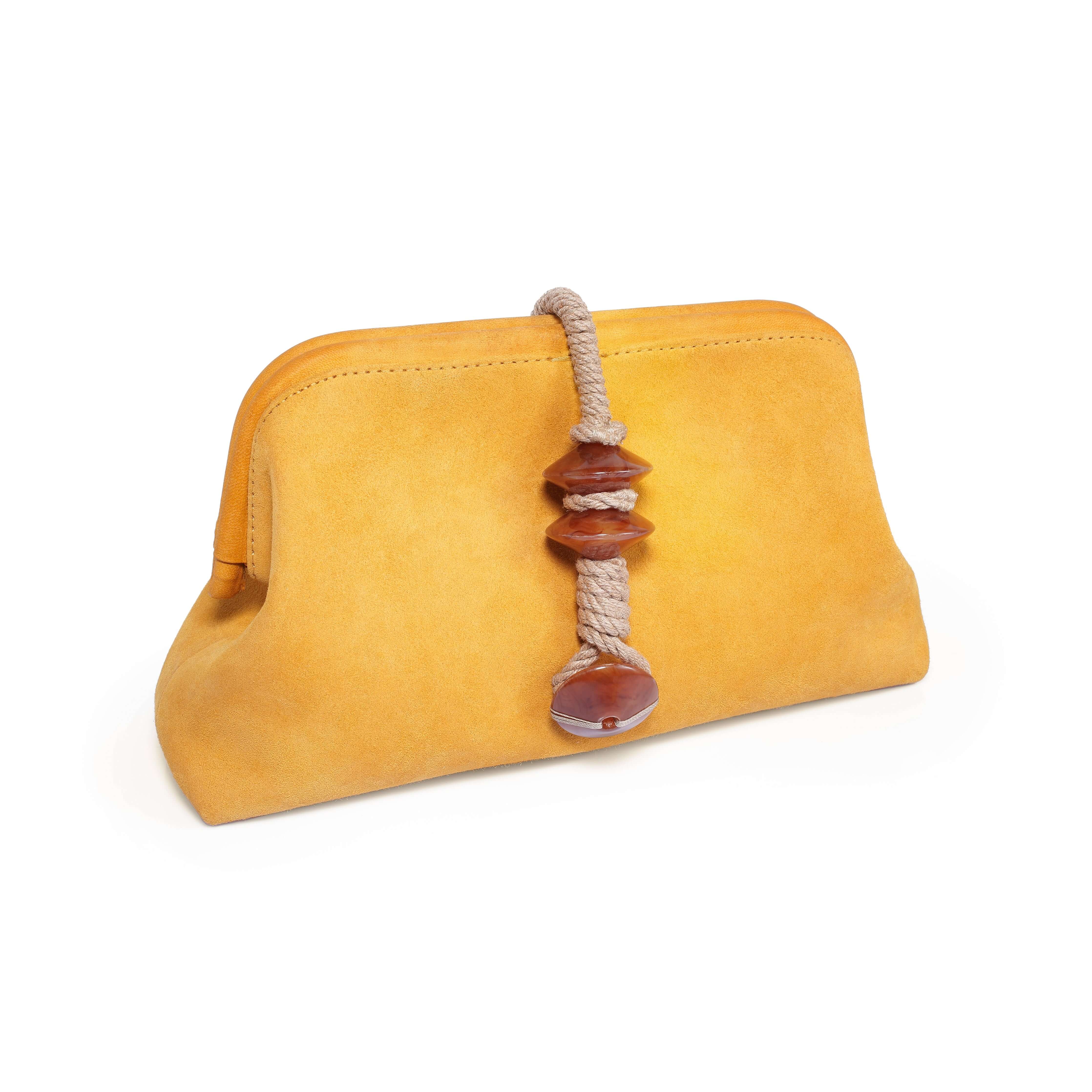 Petra Mustard Pouch Bag featuring a vibrant mustard color and decorative bead detailing.