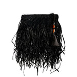 Phedora Black Clutch featuring raffia and stone design in black and almond with decorative tassel and bead accents.