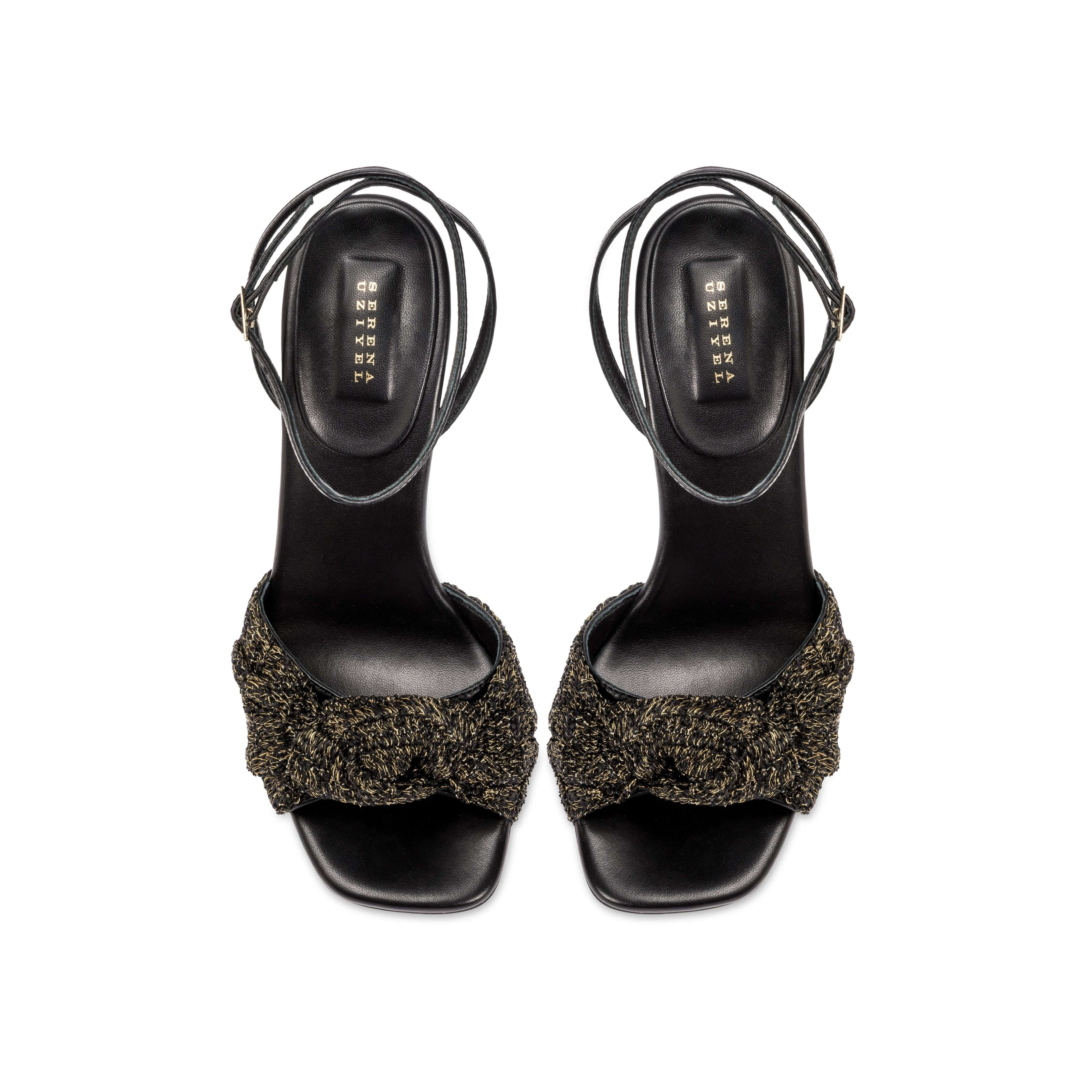 Rhea Black Ankle Cross Sandal featuring smooth leather and a crochet knotted front detail.