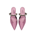 Roxana Lila Mules Pump in elegant pink satin with braided strap detail, perfect for stylish occasions.