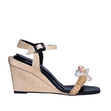 Taurea Natural Wedge Ankle Sandal featuring raffia, natural stone embellishments, and braided jute details.
