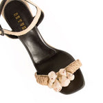 Taurea Natural Wedge Ankle Sandal with raffia, natural stone embellishments, and leather straps for summer comfort.