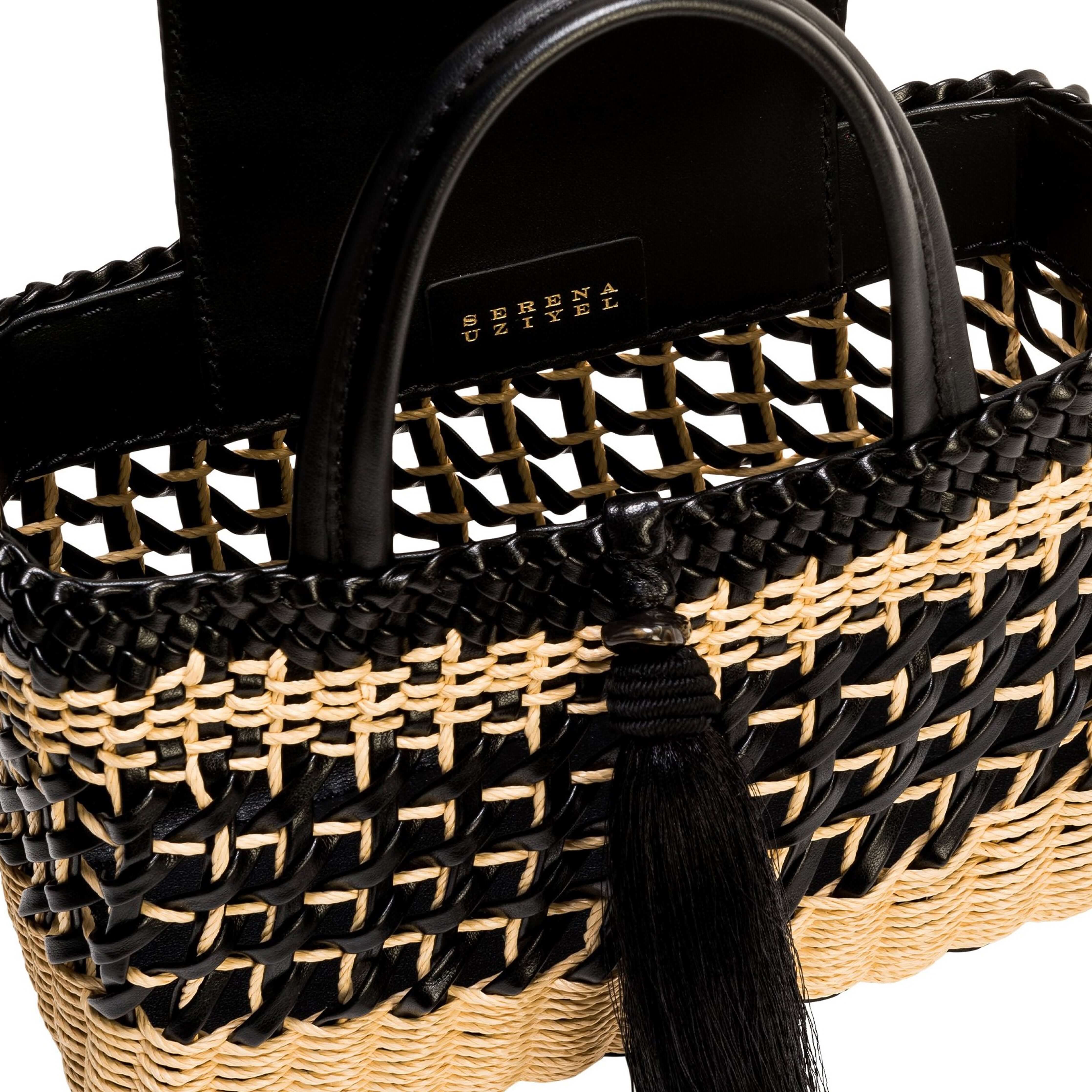 Almeria Tassel Black Mini Tote Bag with raffia weaving and black leather trim, featuring a stylish tassel accent.