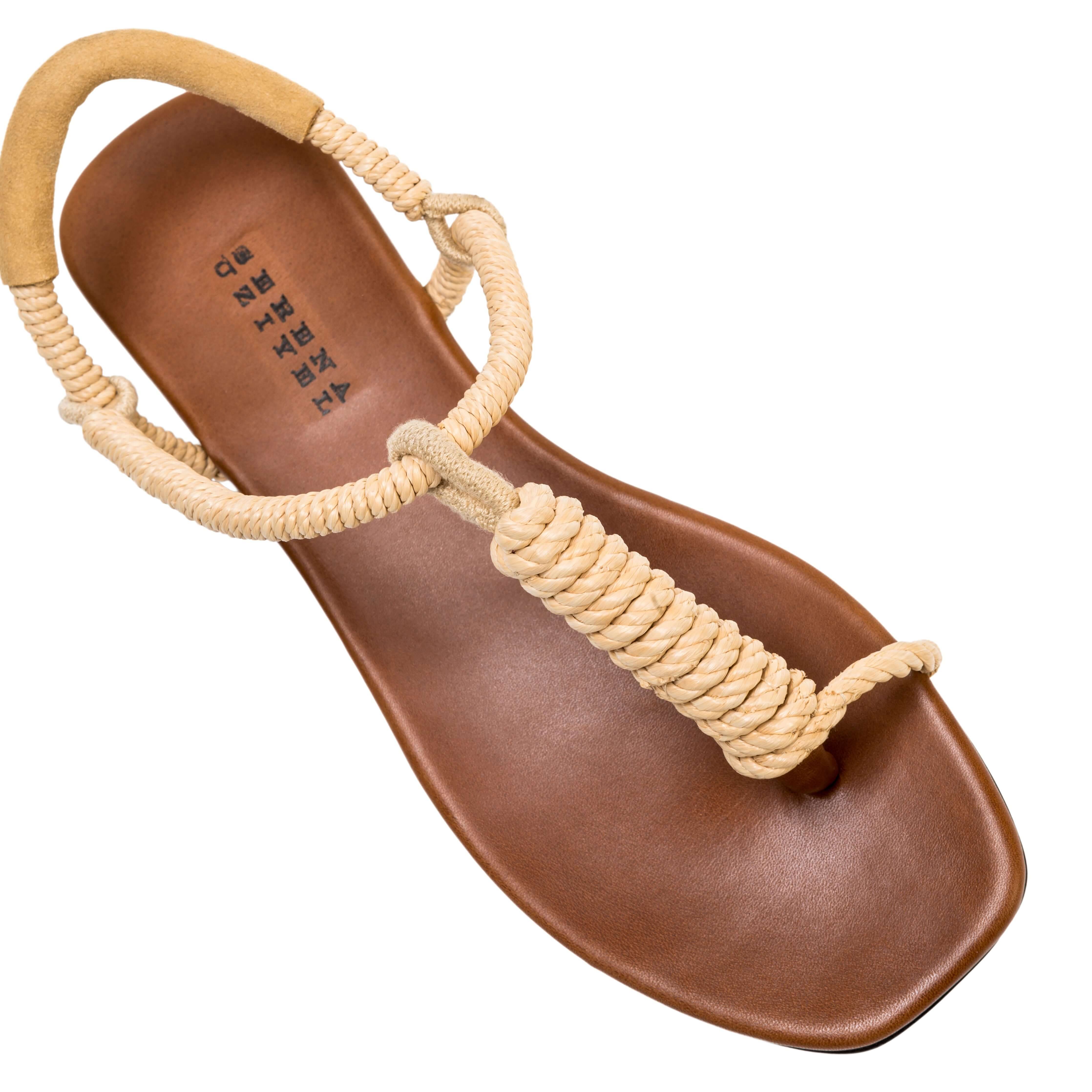 Iris Camello Flat Toe Sandal with rope detailing and a smooth brown sole, perfect for summer style.